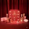 Charlotte Tilbury Hollywood Beauty Wonderland Advent Calendar 2026 with its full line-up of makeup and skincare in front of the red keepsake box