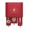 Open drawers of the Charlotte Tilbury Advent Calendar 2026 showing the white quartz gua sha and the Unreal Lips Nectar Oil