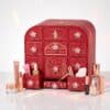 Charlotte Tilbury Advent Calendar 2026 open with full-size and travel-size products on a white background