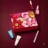Clarins Advent Calendar 2026 box with skincare and make-up minis on burgundy