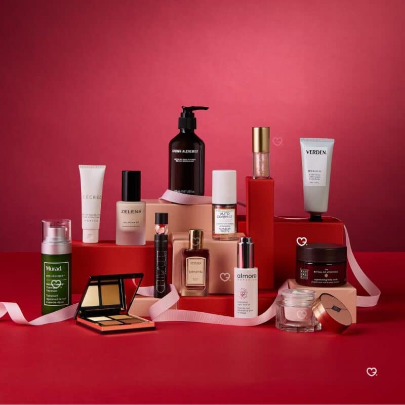 All 27 products from the ELLE Beauty Advent Calendar 2026 arranged on a red background, including Charlotte Tilbury, Tatcha and Zelens skincare