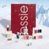 Essie Advent Calendar 2026 nail polishes arranged in snow for a December countdown