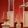Pouring a Flaviar Advent Calendar 2026 whisky sample into a Glencairn glass