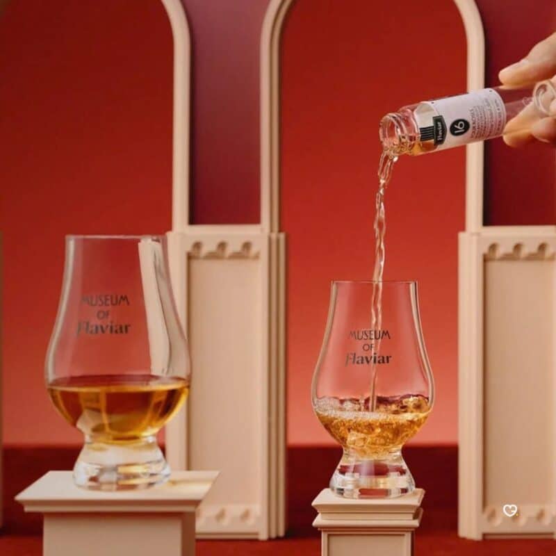 Pouring a Flaviar Advent Calendar 2026 whisky sample into a Glencairn glass