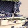 Detail of the Jo Malone Christmas Kist tartan stockings and drawers