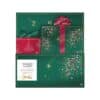 Yankee Candle Book Advent Calendar 2026 closed, green 24 Days of Fragrance book box with gold firework print and red bow