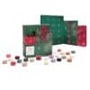 Yankee Candle Book Advent Calendar 2026 contents laid out, 24 scented tea lights and the clear glass holder