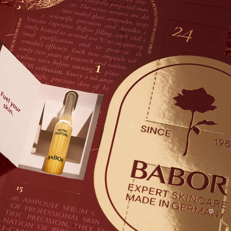 Open door of the Babor Advent Calendar 2026 revealing a Nutri Restore ampoule