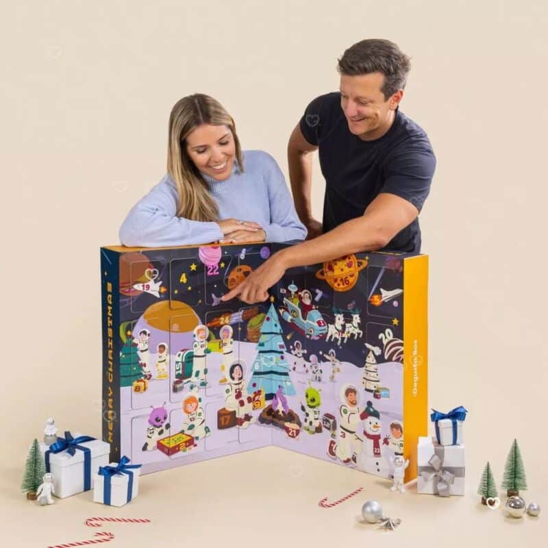 Couple opening the Degusta Box XXL food advent calendar 2026 at home in December