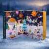 Degusta Box Advent Calendar 2026 open on real snow in a festive Cosmic Christmas setting