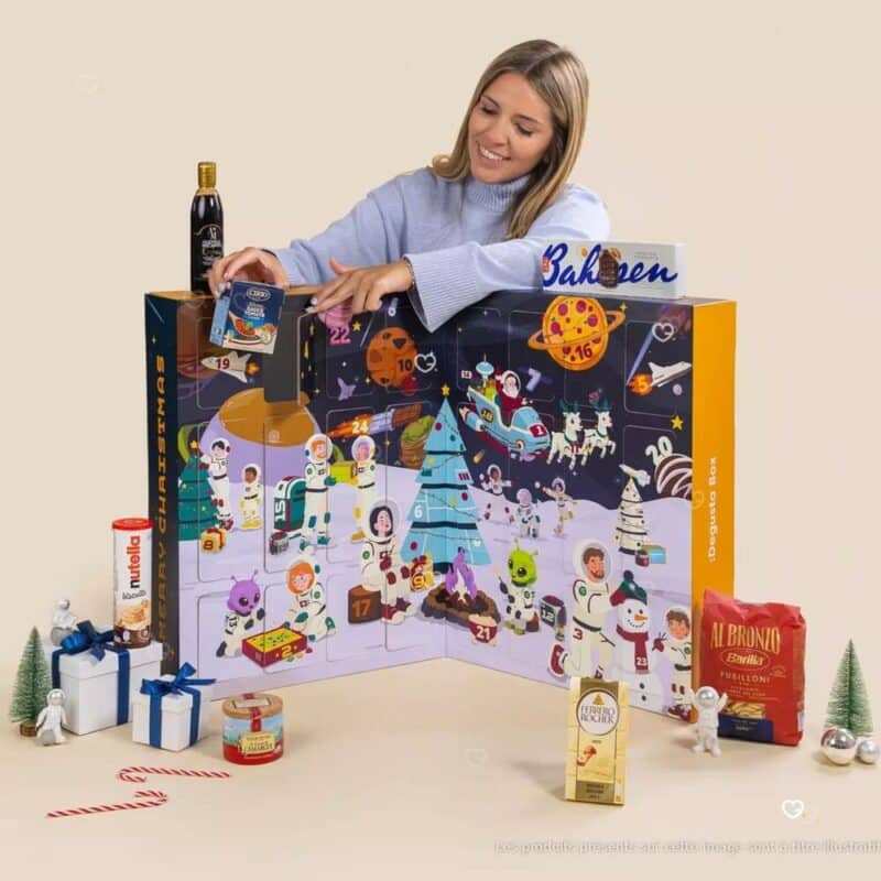 Degusta Box food advent calendar 2026 with full-size treats in the foreground, illustrative image as the 2026 line-up is not disclosed