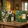 L'Occitane skincare Advent Calendar 2026 closed green box in a festive Christmas setting