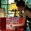 Woman opening the Sisley Paris Advent Calendar 2026 at home