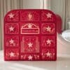 Charlotte Tilbury Advent Calendar 2026 on a white console table in front of a mirror
