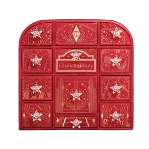 Charlotte Tilbury Advent Calendar 2026, closed red 12-door beauty chest on a white background