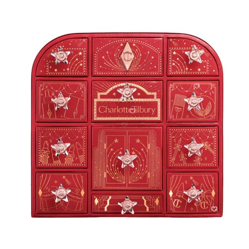 Charlotte Tilbury Advent Calendar 2026, closed red 12-door beauty chest on a white background