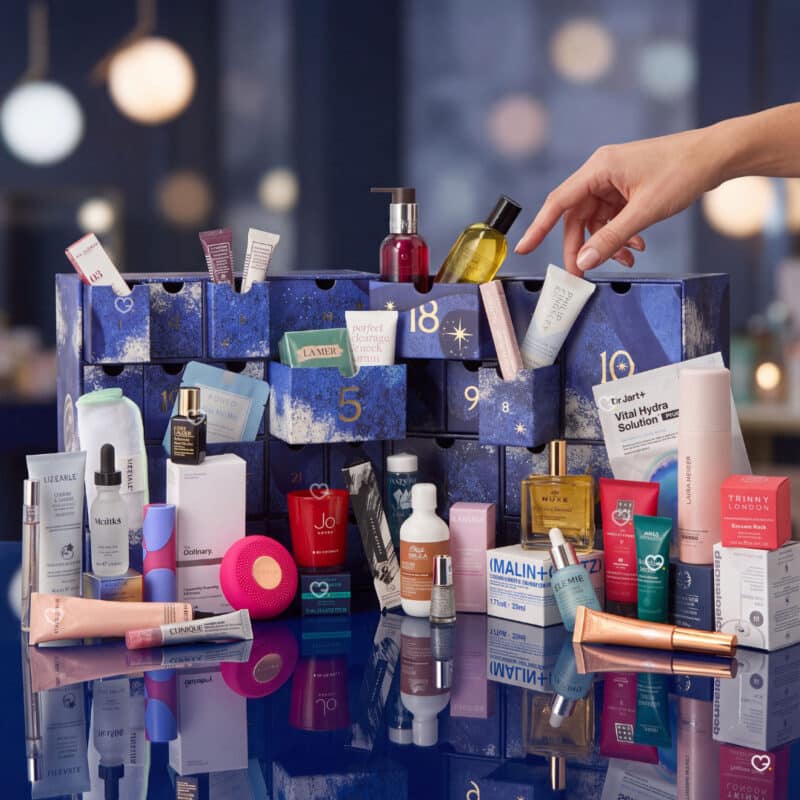 Hand reaching into the John Lewis beauty advent calendar 2026 drawers