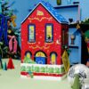 Lush 29½ High Street advent calendar house box in a festive blue room with disco balls