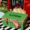 Closed Lush advent calendar wicker hamper under the Christmas tree