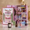 Anthropologie 2026 beauty advent calendar with its contents on a cream and gold festive backdrop