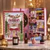 Anthropologie advent calendar 2026 displayed on marble with golden Christmas trees and its beauty products
