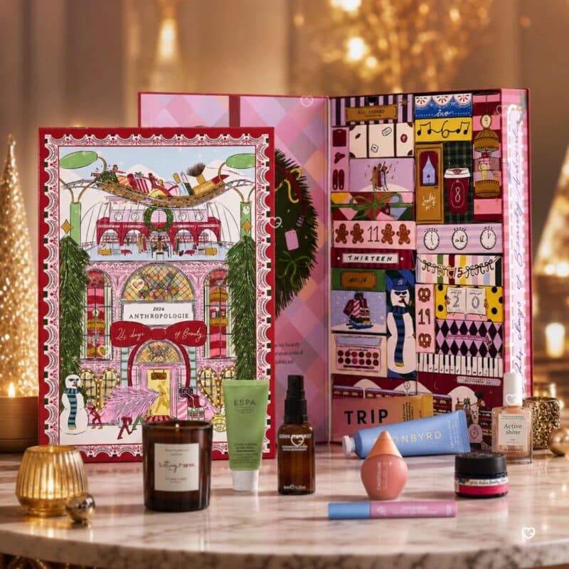 Anthropologie advent calendar 2026 displayed on marble with golden Christmas trees and its beauty products