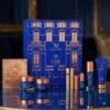 Augustinus Bader advent calendar 2026 skincare set styled on a gold table