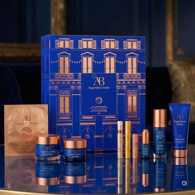 Augustinus Bader advent calendar 2026 skincare set styled on a gold table