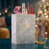 Cult Beauty Advent Calendar 2026 styled in a festive Christmas scene with lights and gold ribbon