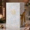 Cult Beauty Advent Calendar 2026 box styled in a Christmas scene with gold ribbon
