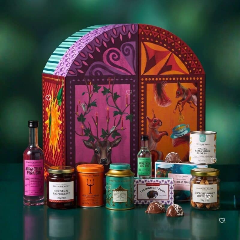 Fortnum's Feasting Advent Calendar 2026 box with gourmet food and drink arranged in front