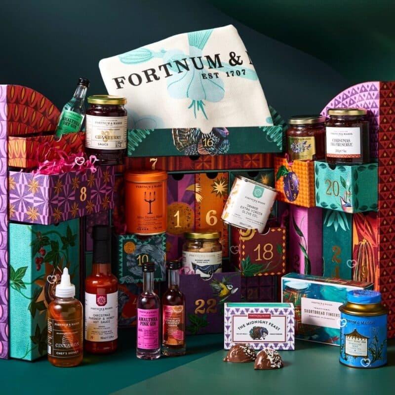 Fortnum's Feasting Advent Calendar 2026 open box with kitchen tea towel and products