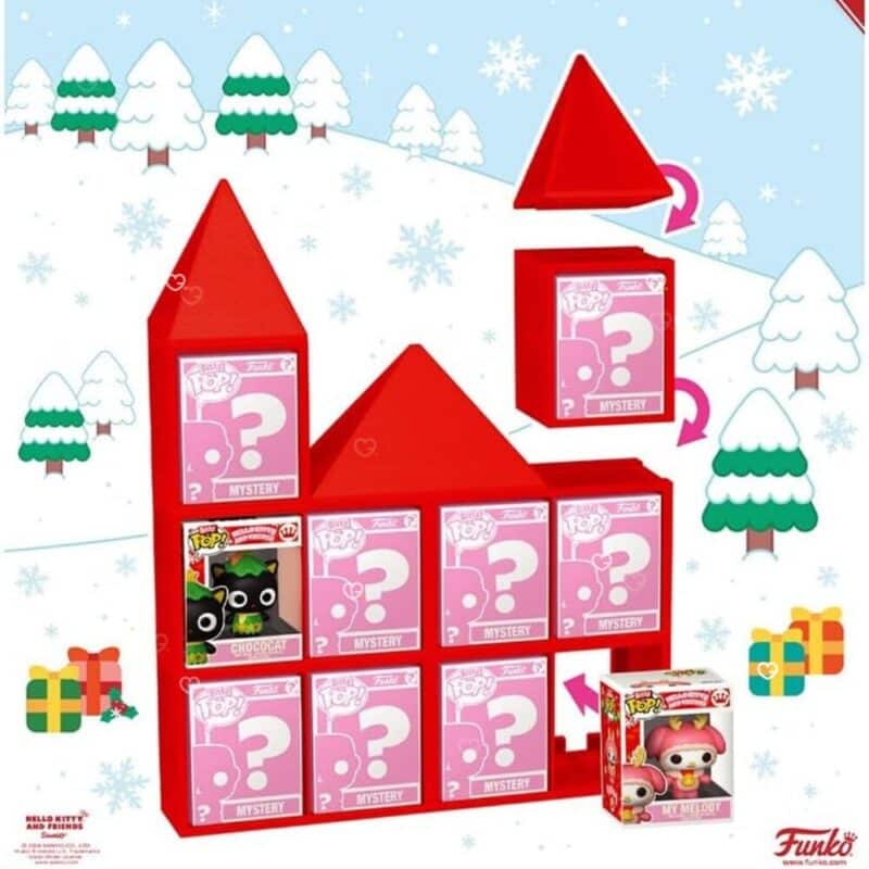 Funko Bitty POP Hello Kitty Sanrio figures in acrylic cases beside the festive castle