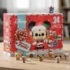 Funko Pocket Pop Disney advent calendar 2026 box beside its exclusive Christmas figures