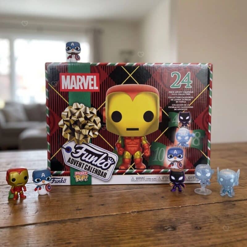 Funko Pocket POP Marvel advent calendar 2026 open with Iron Man, Captain America snowman, Black Panther gingerbread and Spider-Man frost figures on wooden table