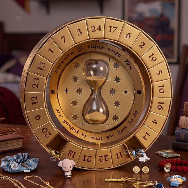 Harry Potter Time Turner Advent Calendar 2026 styled on a desk with the jewellery pieces laid out