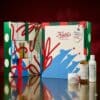 Kiehl's Advent Calendar 2026 open on a red background with three skincare products