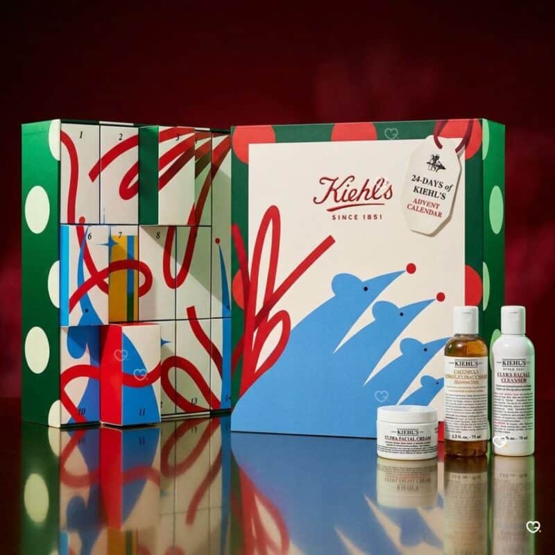Kiehl's Advent Calendar 2026 open on a red background with three skincare products