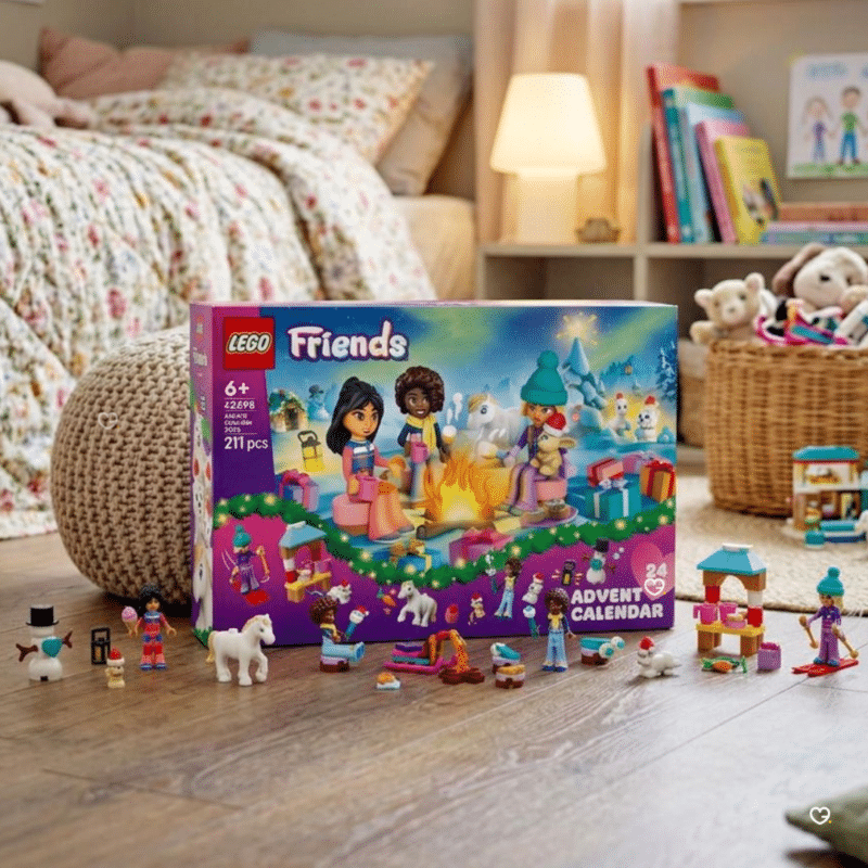 LEGO Friends building advent calendar 42698 contents displayed in a childs bedroom