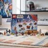 LEGO Star Wars 75456 Advent Calendar 2026 with all minifigures and mini-vehicles laid out in front of the box