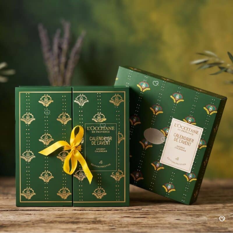 L Occitane Luxury Advent Calendar 2026 packaging, front ribbon and peacock-motif back, beauty advent calendar