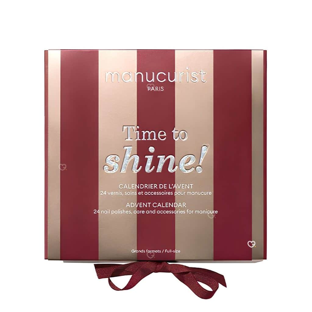 Manucurist Advent Calendar 2026 Time to Shine closed box in burgundy and rose gold stripes
