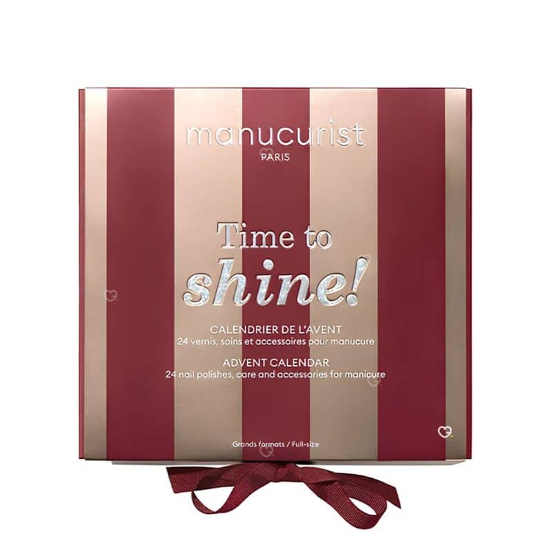 Manucurist Advent Calendar 2026 Time to Shine closed box in burgundy and rose gold stripes