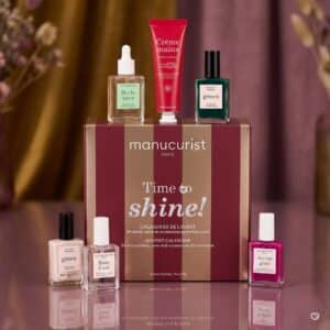 Manucurist advent calendar 2026 with Huile Verte, Rose Hand Cream and Emerald green polish in a floral setting