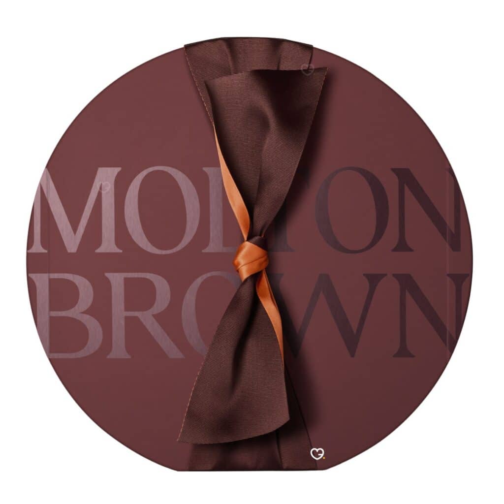 Molton Brown Advent Calendar 2026 round marble-brown box tied with a copper ribbon bow