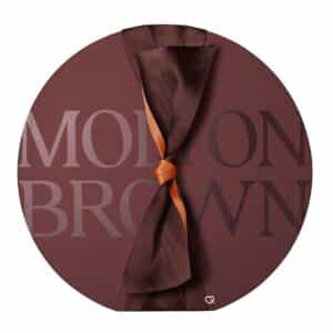 Molton Brown Advent Calendar 2026 round marble-brown box tied with a copper ribbon bow