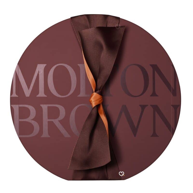 Molton Brown Advent Calendar 2026 round marble-brown box tied with a copper ribbon bow