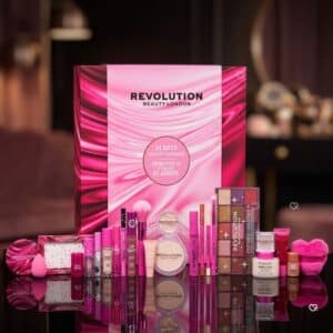 All 24 products from the Revolution Beauty Advent Calendar 2026 laid out on a dark background
