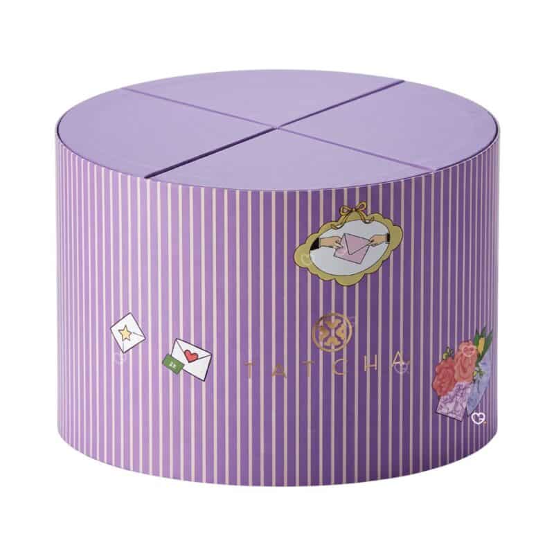 Tatcha '12 Ways to Love Your Skin' advent calendar 2026, the purple round gift chest with gold detailing on a white background