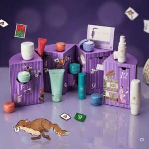 Tatcha skincare advent calendar 2026 open, showing the twelve miniature product drawers inside the purple chest